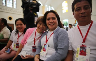 Typhoon Yolanda survivor Elena Garado (second from left) at the Cathedral of the Transfiguration of Our Lord, in Palo, Philippines, Jan. 17, 2015.   Alan Holdren/CNA.