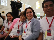 Typhoon Yolanda survivor Elena Garado (second from left) at the Cathedral of the Transfiguration of Our Lord, in Palo, Philippines, Jan. 17, 2015. 