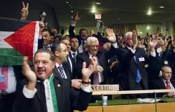 President Mahmoud Abbas (front center) of the Palestinian Authority celebrates recognition with his delegation in the General Assembly Hall on Nov. 29, 2012. ?w=200&h=150