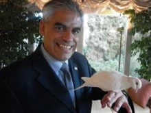 U.S. Ambassador to the Holy See Miguel Diaz poses Oct. 28, 2011 with Chiara the dove