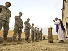 US Army chaplain Fr. Carl Subler says Mass for soldiers in Badula Qulp, Helmand province, Afghanistan, Feb. 21, 2010. USAF photo by Tech. Sgt Efren Lopez.