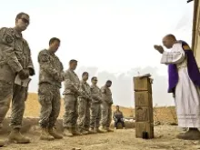 U.S. Army chaplain Fr. Carl Subler celebrates Mass for soldiers in Badula Qulp in Helmand province, Afghanistan, Feb. 21, 2010. 
