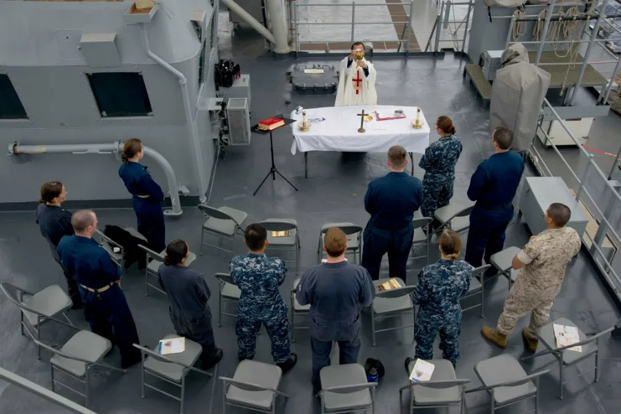 US Navy Chaplain Lt. Tung Tran says Mass aboard the USS Rushmore, June 21, 2014. ?w=200&h=150
