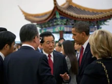 Chinese president Hu Jintao speaks with President Obama during a 2009 visit to China