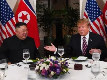 US President Donald Trump (R) and North Korea's leader Kim Jong Un sit for a dinner at the Sofitel Legend Metropole hotel in Hanoi, Feb. 27, 2019. 