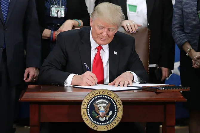 US President Donald Trump signs two executive orders during a visit to the Department of Homeland Security Credit hip Somodevilla Getty Images CNA