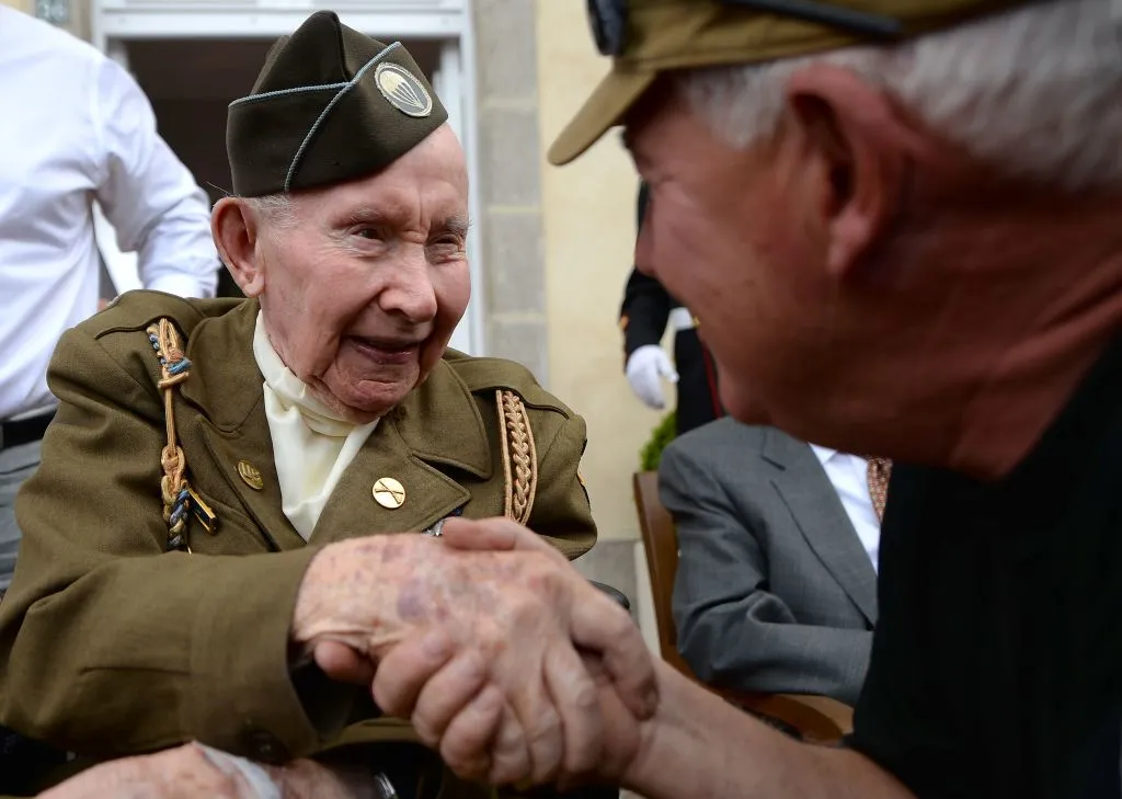 US World War II veteran Joe Riley of the 501st airborne (L), 98, in Sainte-Marie-du-Mont, France, June 6, 2019, for D-Day commemorations. ?w=200&h=150