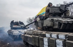 Ukrainian soldiers drive tanks along the road leading out of Debaltseve Feb. 19, 2015 in Artemivsk, Ukraine.   Brendan Hoffman/Getty Images News/Getty Images.