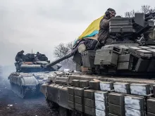 Ukrainian soldiers drive tanks along the road leading out of Debaltseve Feb. 19, 2015 in Artemivsk, Ukraine. 