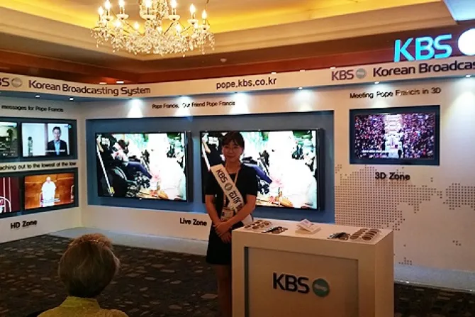 University student Sun Joo Pae assists international press at the KBS stand inside the media center at the Lotte Hotel in Seoul South Korea Credit Elise Harris CNA CNA 8 14 14