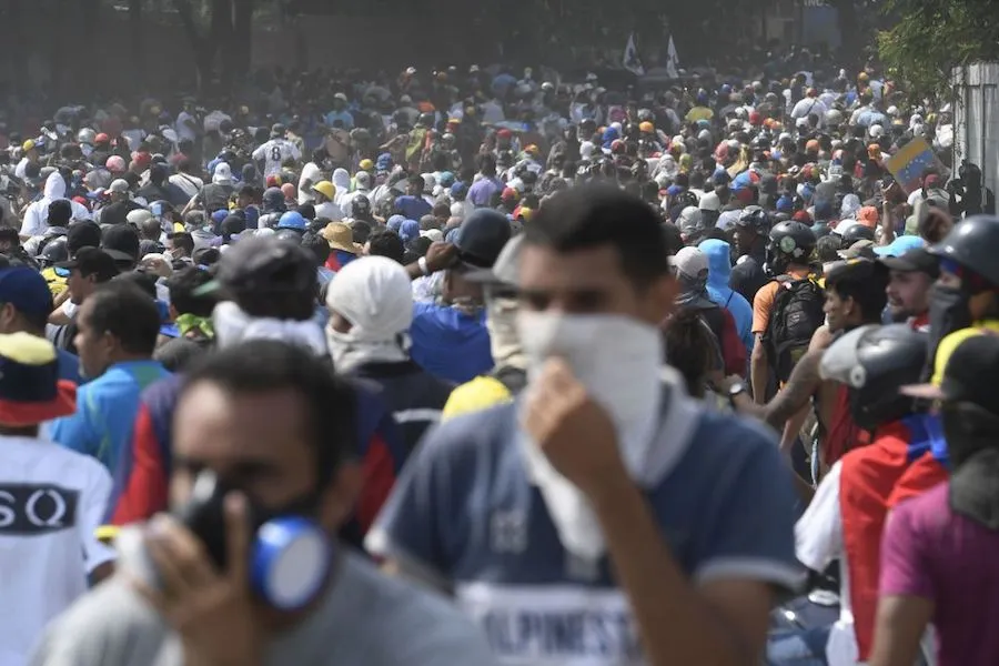 Anti-government protesters take part in a march in Caracas May 1, 2019 after clashes spurred by Juan Guaido's call on the military to rise up against Maduro. ?w=200&h=150