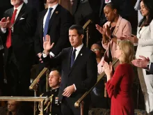 Venezuelan opposition leader Juan Guaido (C) waves as he is acknowledged by Donald Trump during his State of the Union address Washington, DC, Feb. 4, 2020. 
