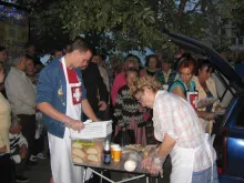 Volunteers distribute food to Ukrainians displaced from their homes by the violence. 