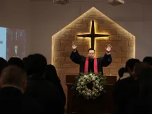 Wang Yi leads a service at Early Rain Covenant Church in Chengdu, China, October 2018. Photo courtesy of Early Rain Covenant Church.