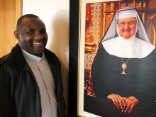 Fr. Don Bosco Onyalla, editor of ACI-Africa, stands with the image of Mother Mary Angelica, foundress of EWTN. 