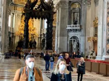 Visitors inside of St. Peter's Basilica March 2020. 