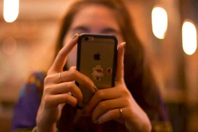 Woman on phone Credit Danupol Noodam via wwwshutterstockcom CNA 9 11 15