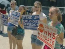 Women protest the Obama administration's contraception mandate. 