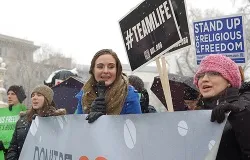Women chant in the snow in support of religious liberty outside the Supreme Court building in Washington, D.C., March 25, 2014. ?w=200&h=150