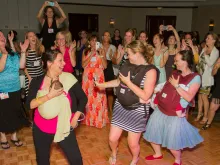 Women from across the nation relax and dance during the Edel Gathering conference in Austin, TX. Photo courtesy of Hallie Lord.