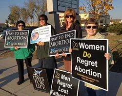 Women pray outside an abortion clinic in Albany, New York. ?w=200&h=150