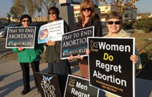 Women pray outside an abortion clinic in Albany, New York.   40daysforlife.com.