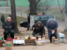Women sell produce on the street in Vitebsk, Belarus, Oct. 27, 2014. 