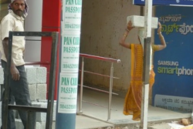 Workers haul bricks at a construction site in Bangalore India Credit Hillary Senour CNA CNA 10 18 13