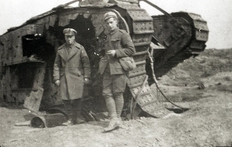 Two soldiers standing beside a World War One tank. ?w=200&h=150