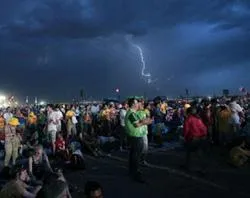 World Youth Day pilgrims during the storm that swept across Cuatro Vientos airfield. ?w=200&h=150