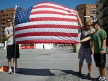 Pilgrims from the Brooklyn diocese display the 9/11 flag