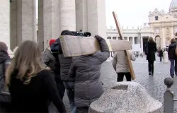 Young people from the Centro San Lorenzo walk into St. Peter's Square with the World Youth Day Cross to pray a rosary for the Pope. ?w=200&h=150