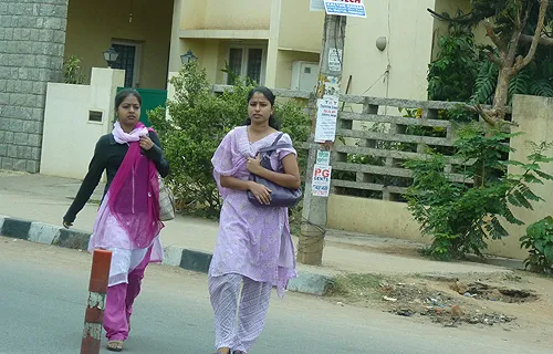 Young professional women walk along the street in Bangalore, India. ?w=200&h=150