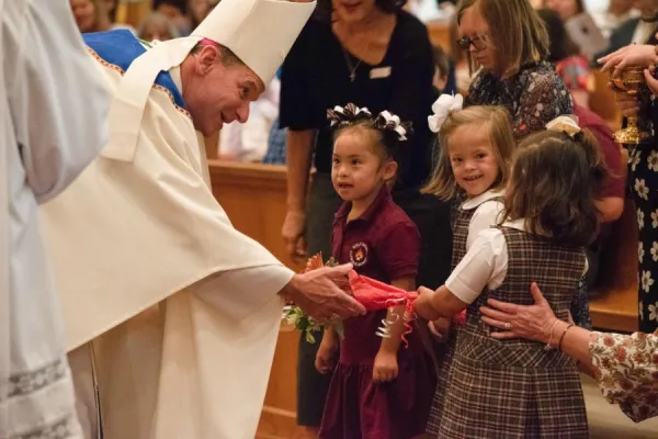 Bishop Michael F. Burbidge accepting the offertory gifts at the Mass for Persons with Disabilities, Sept. 29. . ZOEY MARAIST/Arlington Catholic Herald