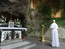 Pope Francis prays at the Lourdes Grotto in the Vatican Gardens May 30, 2020. 