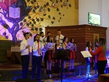 Young Chaldean Catholics refugees from Iraq perform a Christmas choral concert in Beirut, Lebanon. 