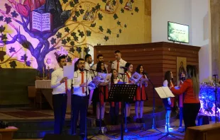 Young Chaldean Catholics refugees from Iraq perform a Christmas choral concert in Beirut, Lebanon.   Hannah Brockhaus/CNA. 