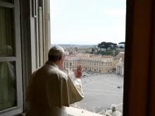 Pope Francis blesses an almost empty St. Peter’s Square April 13, 2020. 