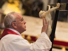  Pope Francis venerating the Cross on Good Friday in St. Peter's Basilica on April 3, 2015. 