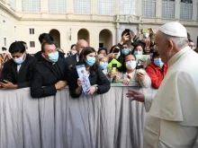 Pope Francis greets pilgrims wearing face masks at the general audience Sept. 30, 2020. 