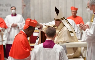 Cardinal Antoine Kambanda receives the red hat from Pope Francis Nov. 28, 2020.