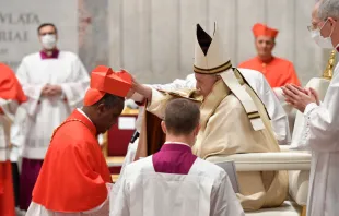 Cardinal Antoine Kambanda receives the red hat from Pope Francis Nov. 28, 2020.  