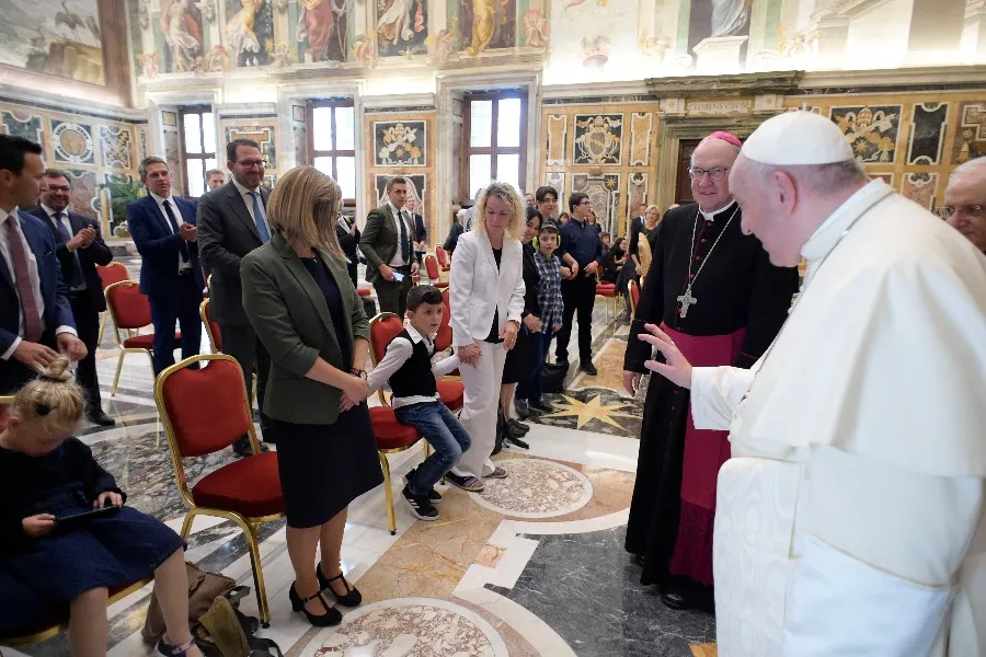 Pope Francis waves to a child at an audience with representatives of the Ambulatorium Sonnenschein in St. Pölten, Austria. ?w=200&h=150