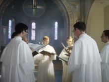 A group of men studying to become priests at St. Michael's Abbey in California.