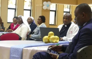 Participants gather at the Aug. 18, 2025, launch event for a new digital app that will bring together 66 Catholic radio stations in east Africa. Father Don Bosco, editor-in-chief of ACI Africa, CNA’s news partner in Africa, is pictured in the center. Credit: ACI Africa