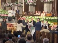 Protesters disrupt the Easter Vigil Mass at St. Patrick's Cathedral in New York City on March 30, 2024.