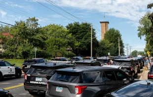 Police cruisers near Annunciation Catholic Church in Minneapolis on Aug. 27, 2025, following a mass shooting that killed two children and injured 17 others, 14 of them children. Credit: Chad Davis, CC BY 4.0, via Wikimedia Commons