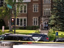 Police gather at Annunciation Catholic School in Minneapolis on Aug. 27, 2025, following a mass shooting that killed two children and injured 17 others, 14 of them children.