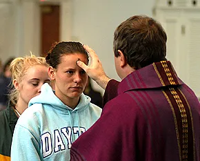 A priest distributes ashes on Ash Wednesday?w=200&h=150
