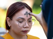 A woman receives ashes on the observance of Ash Wednesday at a church in Manila, Philippines, on March 5, 2025. The 40-day period of Lent begins for Catholics around the world on Ash Wednesday.